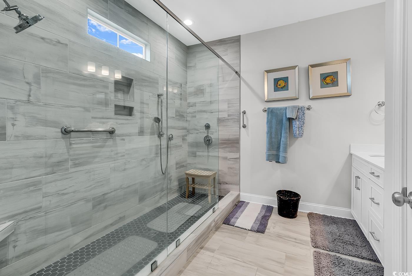 6024 Curran Street Murrells Inlet, SC 29576 - Photo 16 of 34 Bathroom with vanity and a shower stall