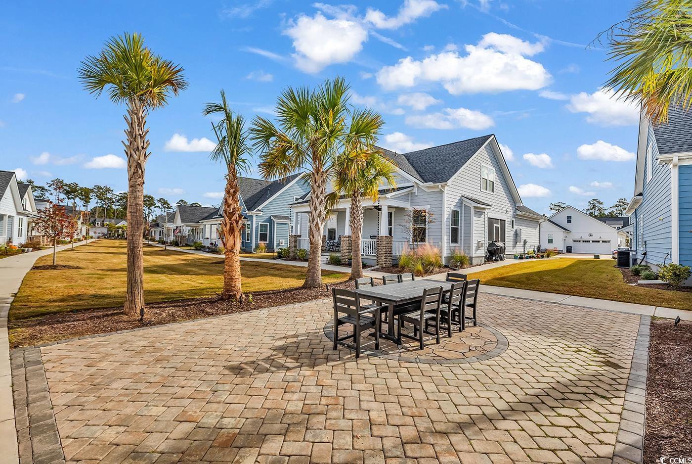 6024 Curran Street Murrells Inlet, SC 29576 - Photo 29 of 34 View of patio / terrace featuring a residential view and outdoor dining space