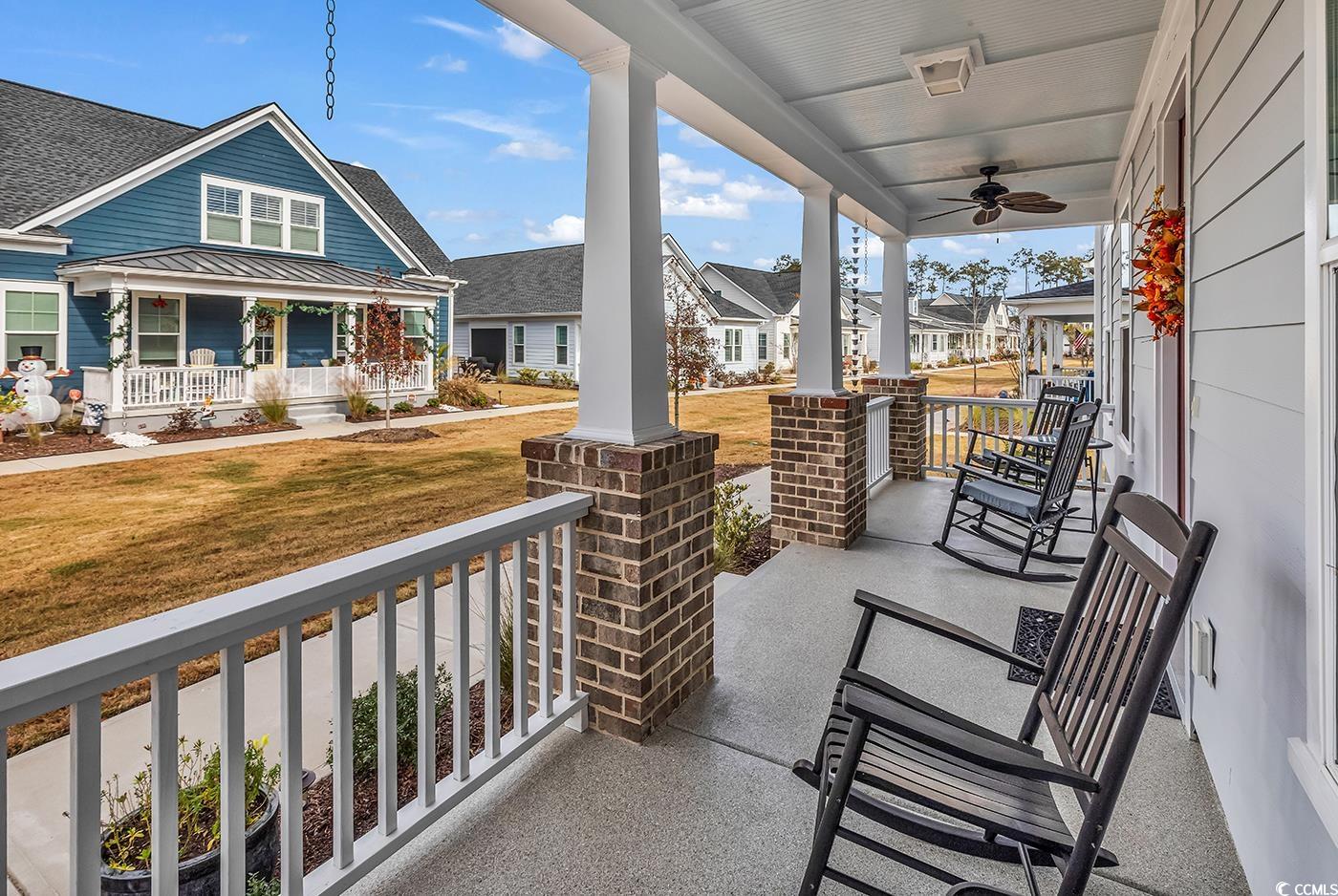 6024 Curran Street Murrells Inlet, SC 29576 - Photo 10 of 34 Porch with a residential view and ceiling fan