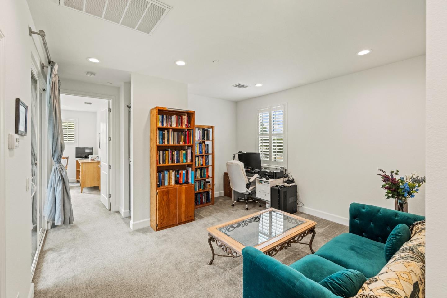 579 Rosa Monte Way Marina, CA 93933 - Photo 12 of 37 a living room with furniture and a book shelf