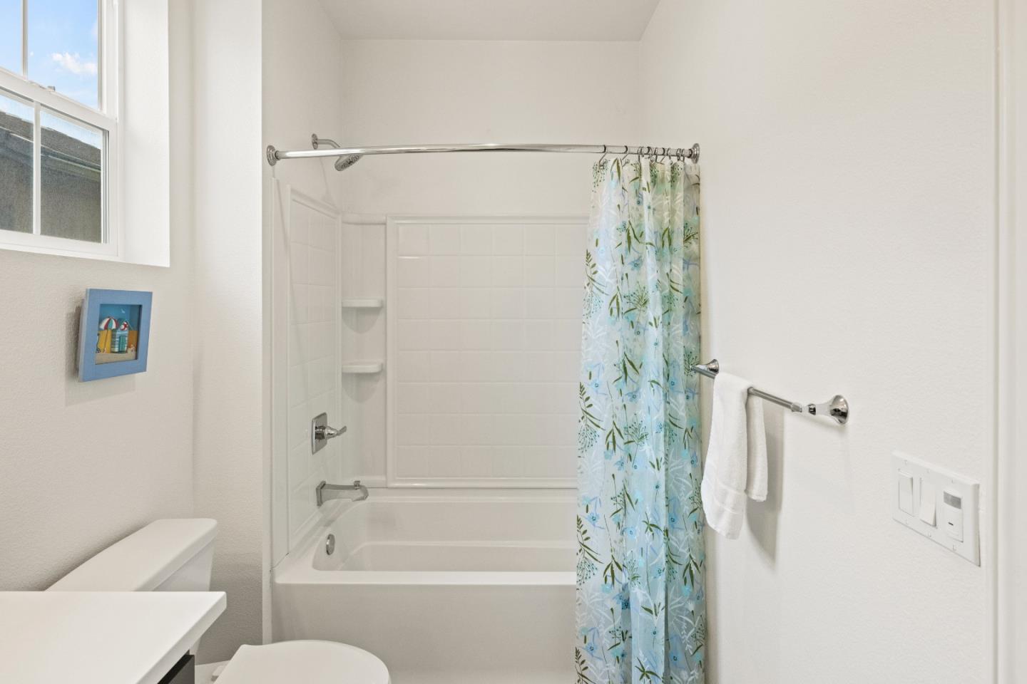 579 Rosa Monte Way Marina, CA 93933 - Photo 17 of 37 a bathroom with a shower curtain and a toilet