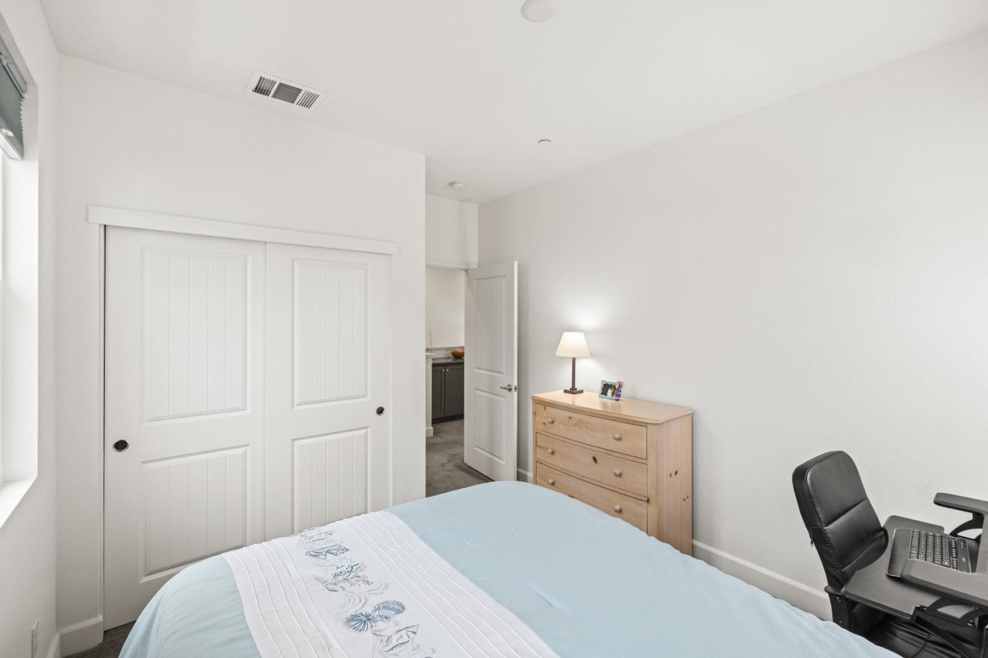 579 Rosa Monte Way Marina, CA 93933 - Photo 19 of 37 a bedroom with a bed and a chair