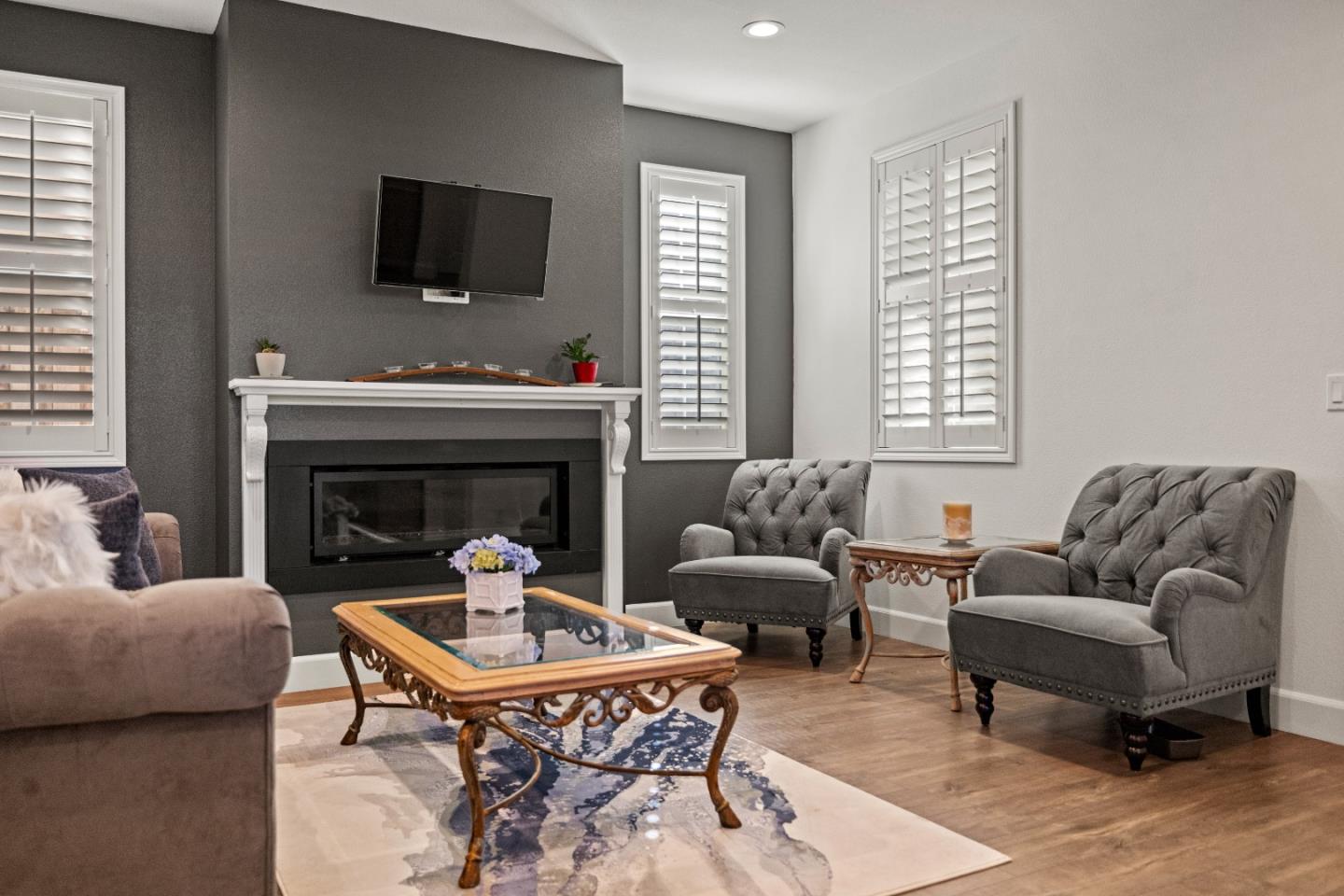 579 Rosa Monte Way Marina, CA 93933 - Photo 33 of 37 a living room with furniture a flat screen tv and a fireplace