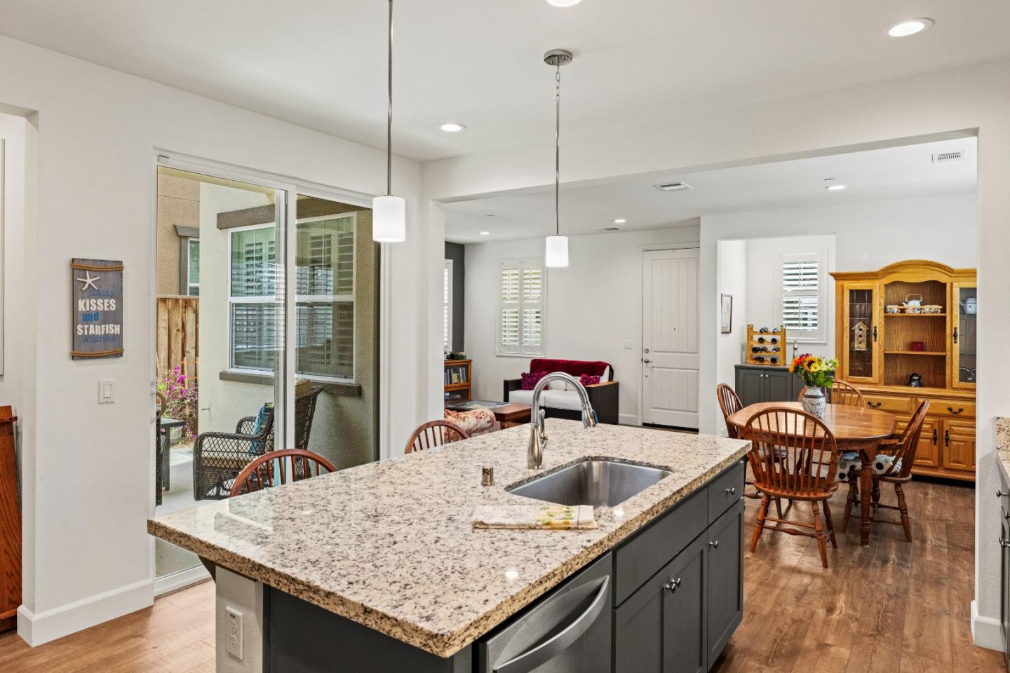 579 Rosa Monte Way Marina, CA 93933 - Photo 8 of 37 a kitchen with a table chairs and wooden floor