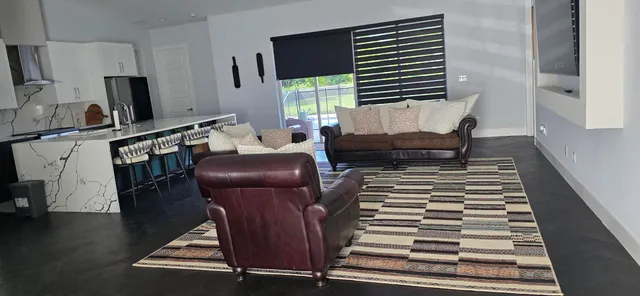 a living room with furniture and a window