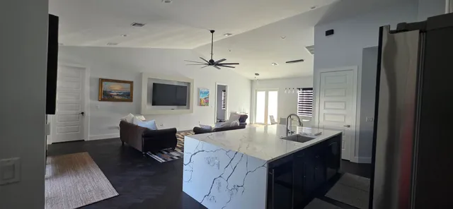 a view of an empty room and wooden floor