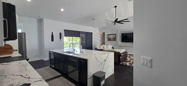 a view of a house with a yard and a garden