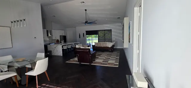 a living room with furniture a window and a fireplace