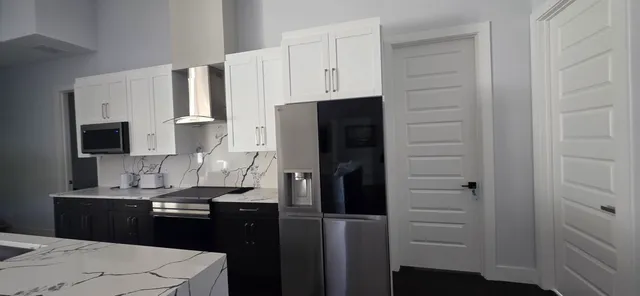 a kitchen with a sink and refrigerator