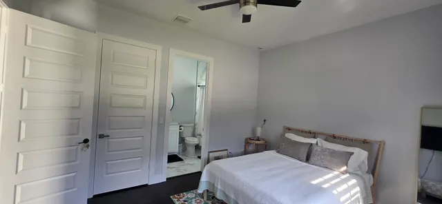 a bedroom with a bed and a shower