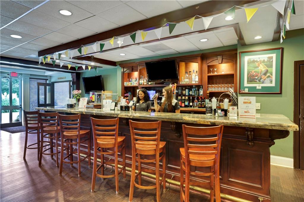 1024 Bear Paw Ridge Dahlonega, GA 30533 - Photo 30 of 55 a kitchen with stainless steel appliances granite countertop table chairs sink and cabinets