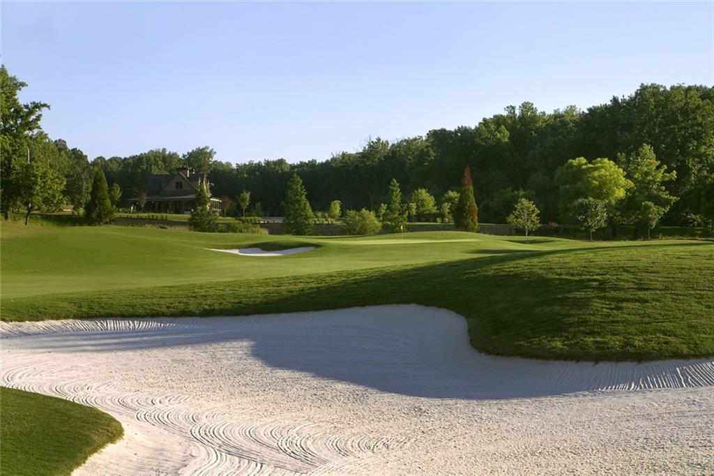 1024 Bear Paw Ridge Dahlonega, GA 30533 - Photo 36 of 55 a view of a golf course with a lake