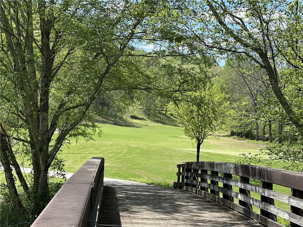 1024 Bear Paw Ridge Dahlonega, GA 30533 - Photo 43 of 55 a view of a wooden deck with a yard