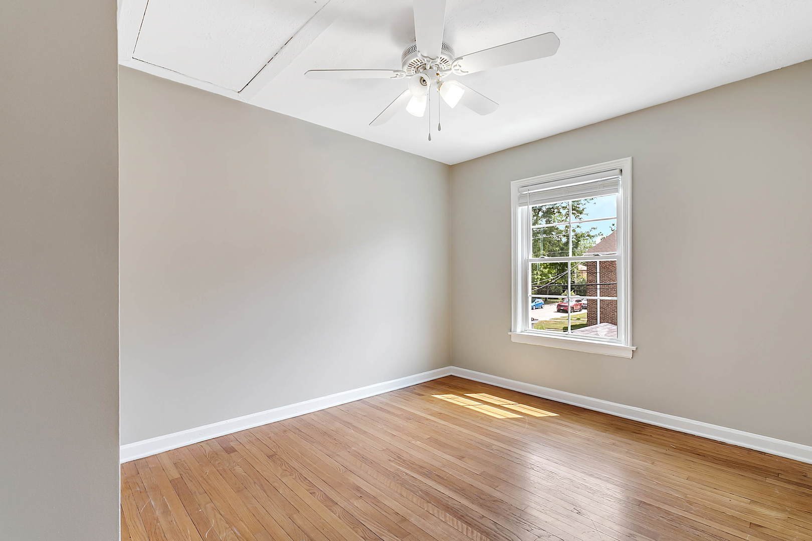 2949 Lincoln Avenue North Riverside, IL 60546 - Photo 11 of 26 an empty room with wooden floor and windows