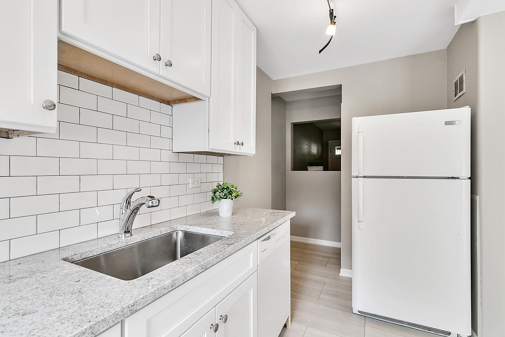 2949 Lincoln Avenue North Riverside, IL 60546 - Photo 2 of 26 a kitchen with a sink and refrigerator