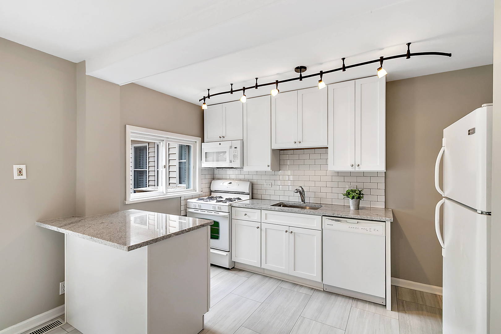2949 Lincoln Avenue North Riverside, IL 60546 - Photo 3 of 26 a kitchen with white cabinets and white appliances