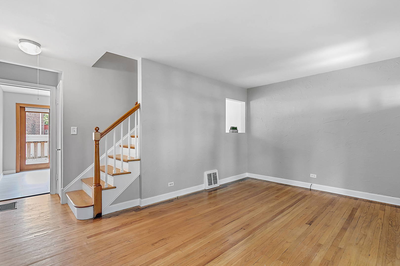 2949 Lincoln Avenue North Riverside, IL 60546 - Photo 6 of 26 a view of an empty room with wooden floor and stairs
