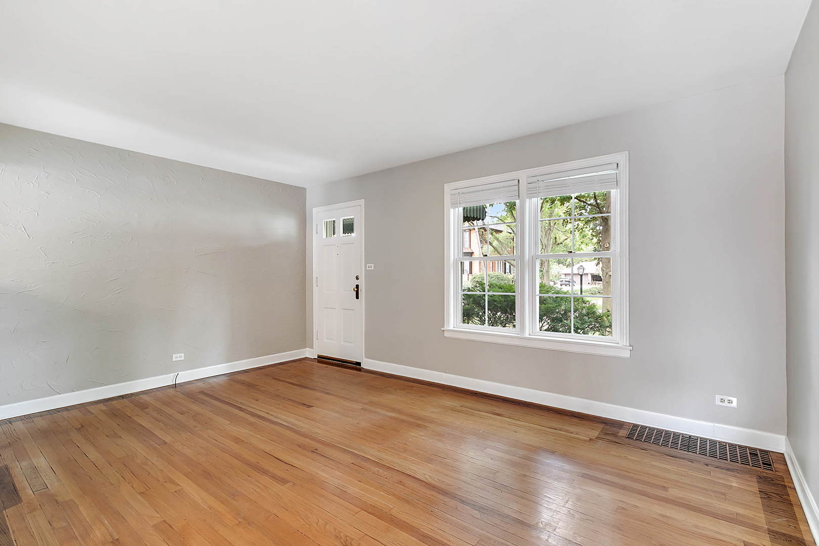 2949 Lincoln Avenue North Riverside, IL 60546 - Photo 7 of 26 an empty room with wooden floor and windows