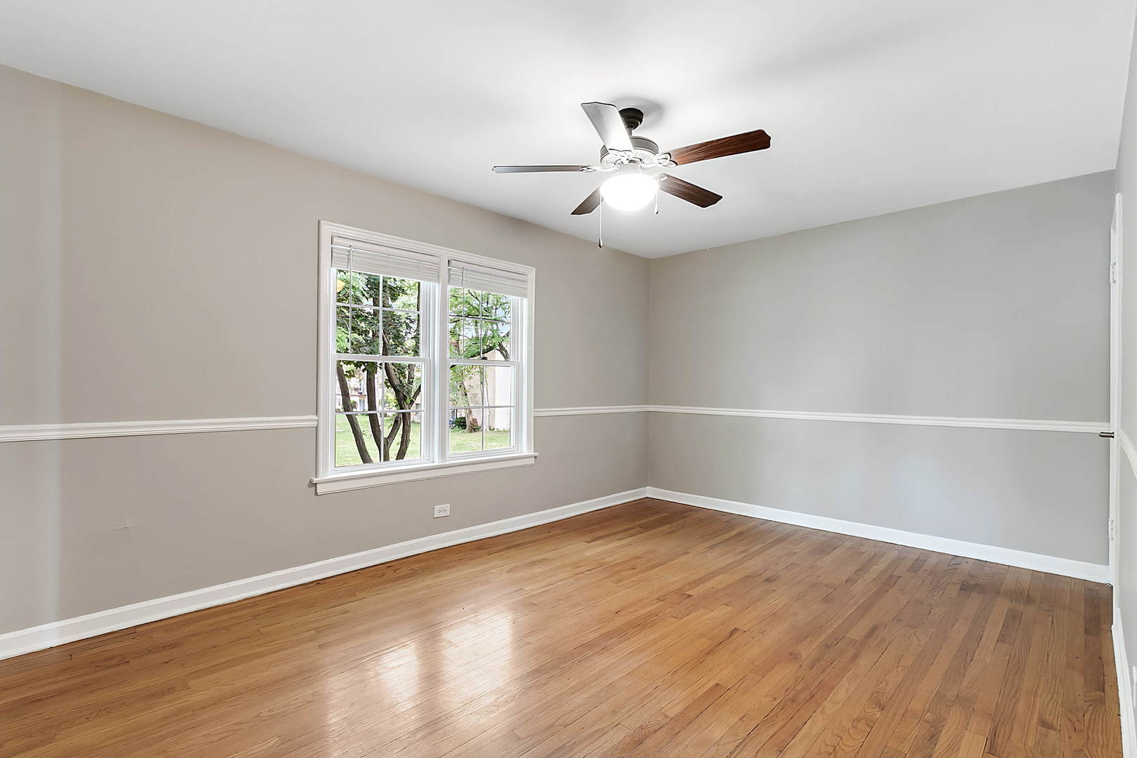 2949 Lincoln Avenue North Riverside, IL 60546 - Photo 9 of 26 a view of an empty room with wooden floor and a window