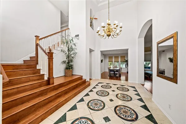 a view of a hallway with furniture