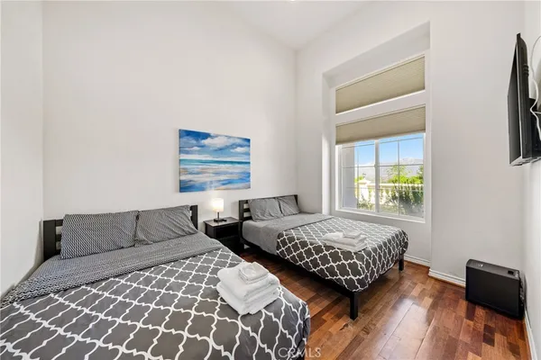 a bedroom with a bed and a window