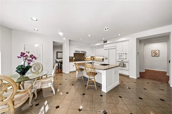 a living room with furniture a dining table and chairs