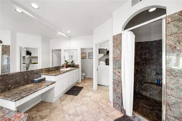 a view of storage and utility room with stairs