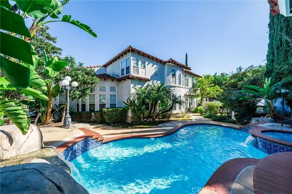 a view of a swimming pool with a patio