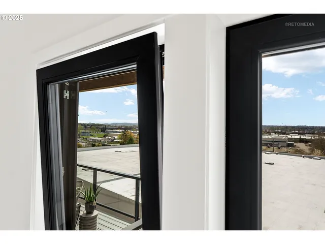 a view of balcony with wooden floor