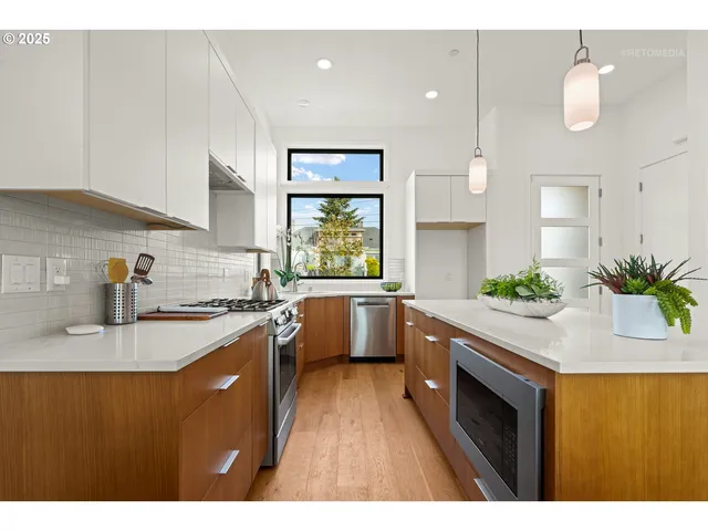 a large kitchen with a table and chairs