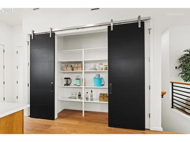 a bathroom with a sink vanity granite and a shower