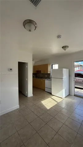 a view of a kitchen with a sink and a stove