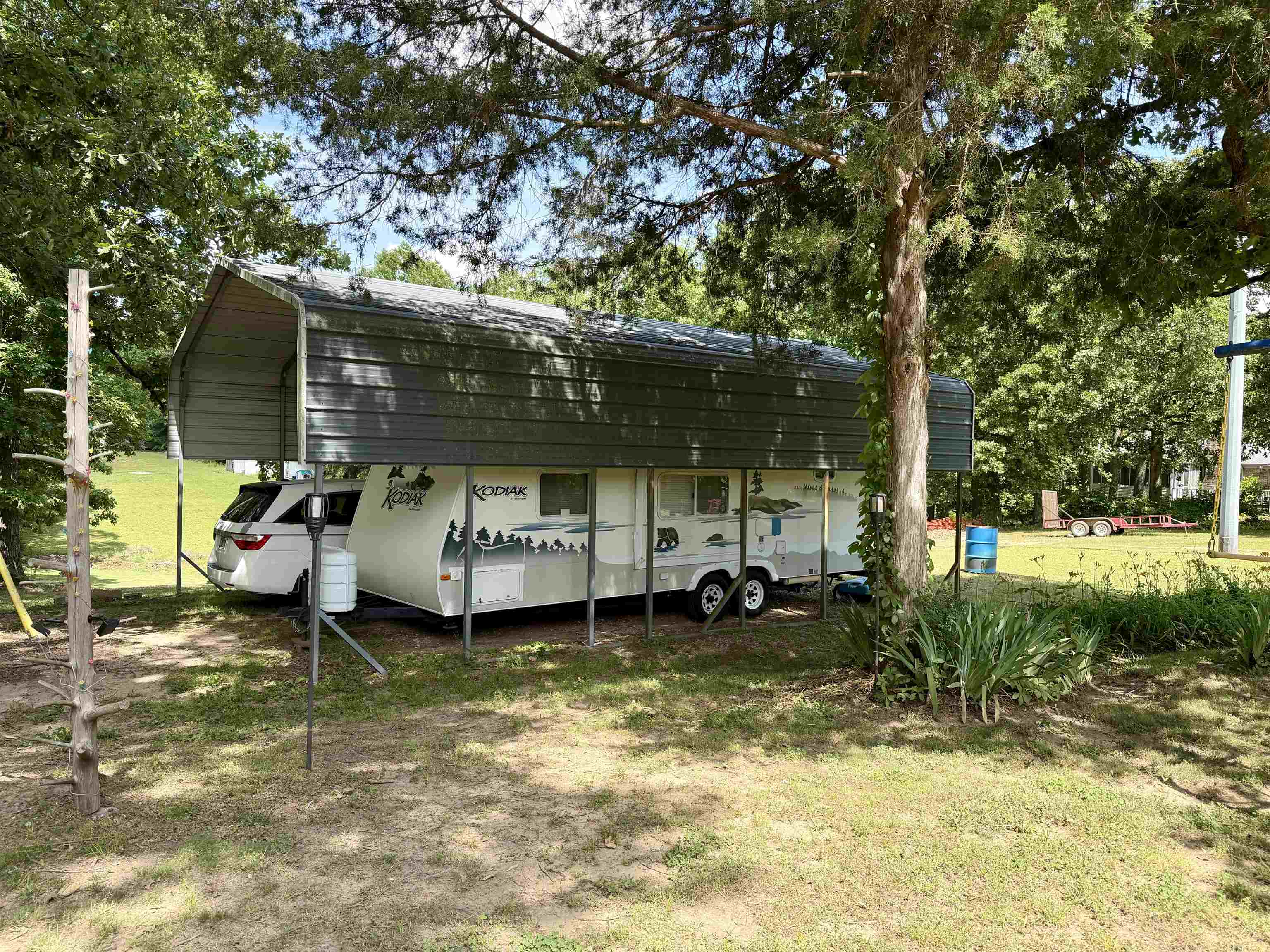 142 Treece Street Selmer, TN 38375 - Photo 36 of 36 Metal carport structure providing covered parking