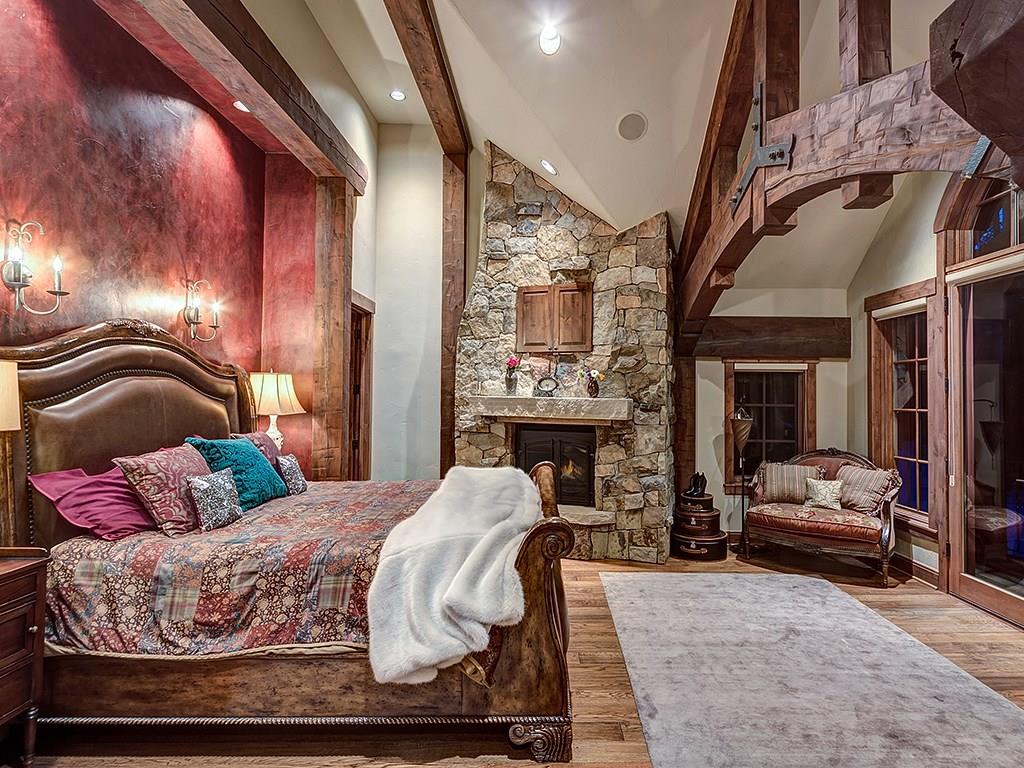 462 Peerless Drive Breckenridge, CO 80424 - Photo 14 of 25 a bedroom with a bed couch and a fireplace