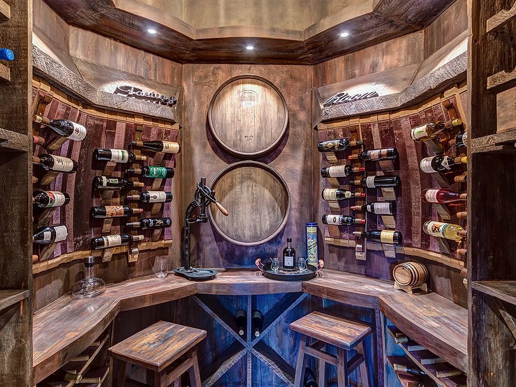 462 Peerless Drive Breckenridge, CO 80424 - Photo 22 of 25 a room with lots of bottles of alcohol and a fan