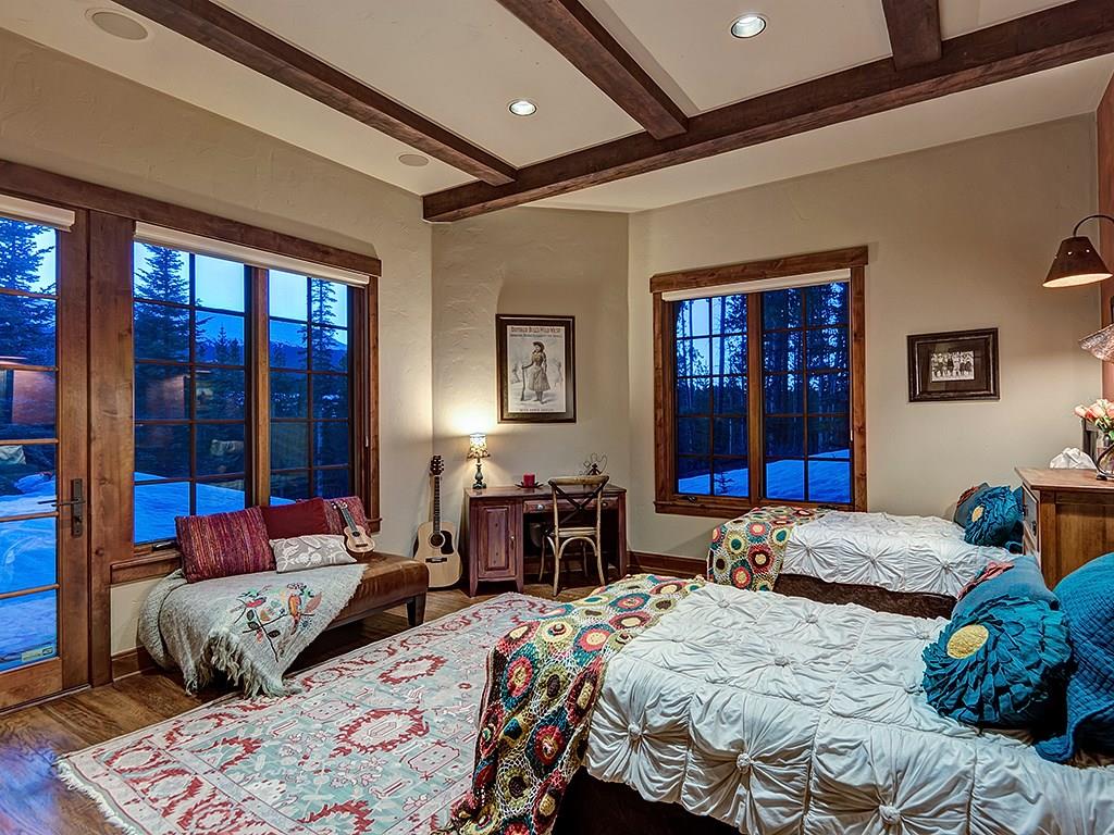 462 Peerless Drive Breckenridge, CO 80424 - Photo 24 of 25 a bedroom with a bed and wooden floor