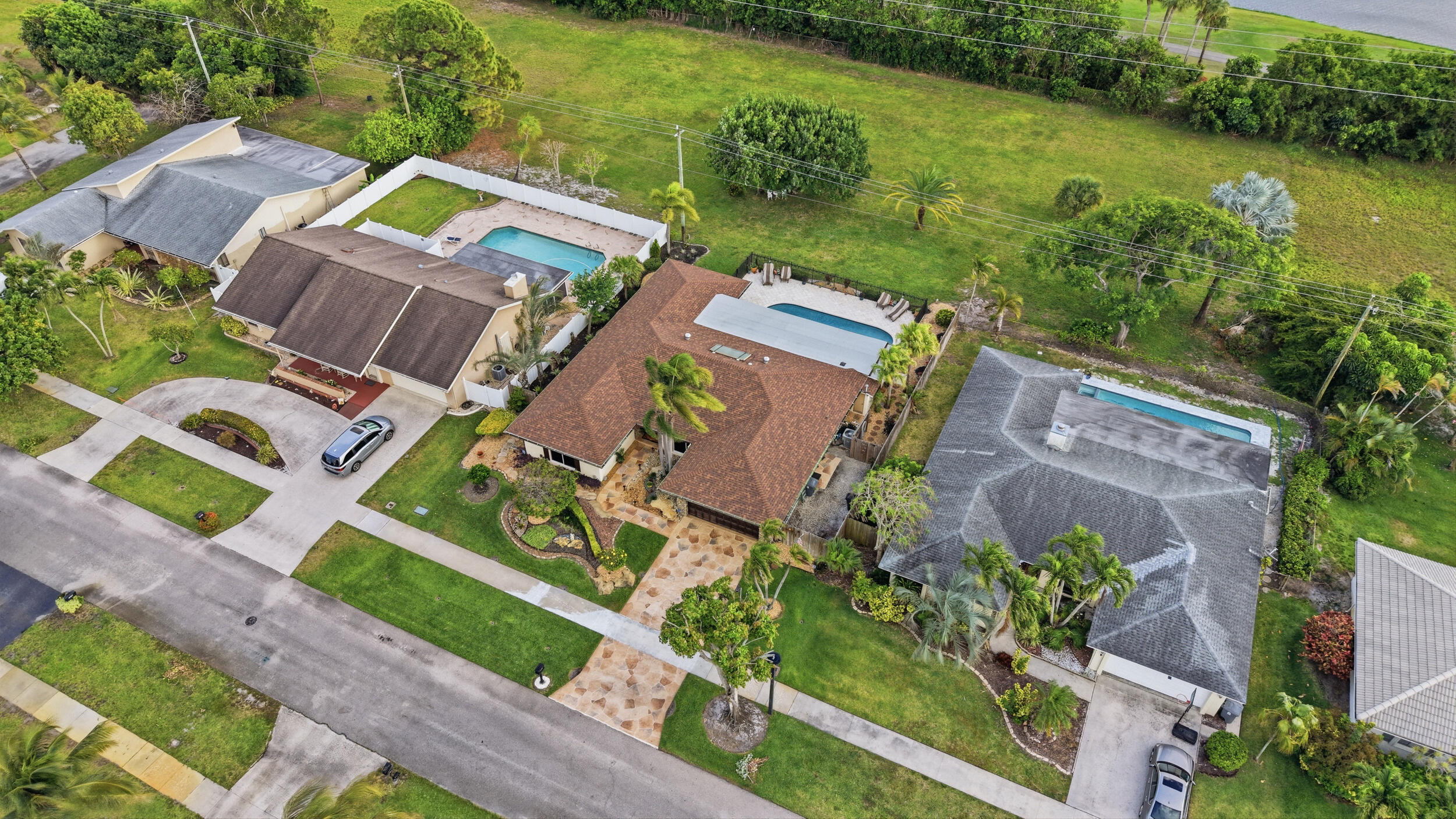 4780 Brandywine Drive Boca Raton, FL 33487 - Photo 36 of 43 an aerial view of a house with a garden and lake view