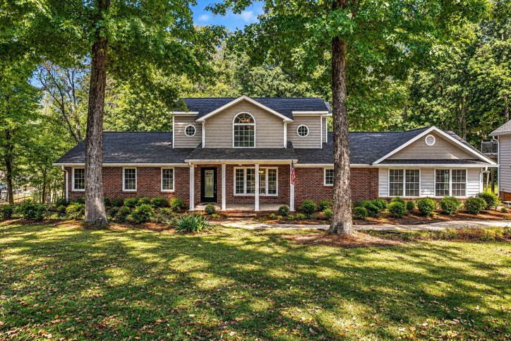 106 Pikes Ridge Anderson, SC 29626 - Photo 1 of 41 Mature trees frame the classic brick and siding facade of this multi-level home.