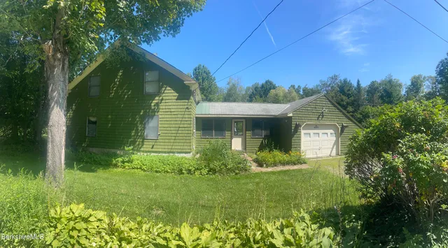 a view of a yard in front of the house
