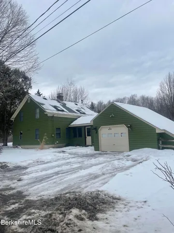 a view of backyard and tree