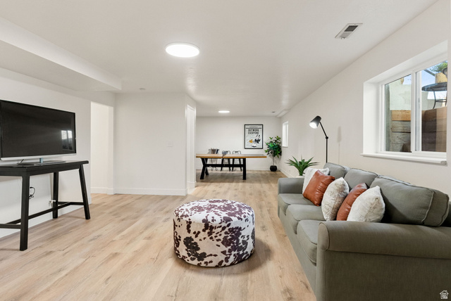 368 Spring Creek Road Providence, UT 84332 - Photo 24 of 45 Living area with light wood-style floors and healthy amount of natural light