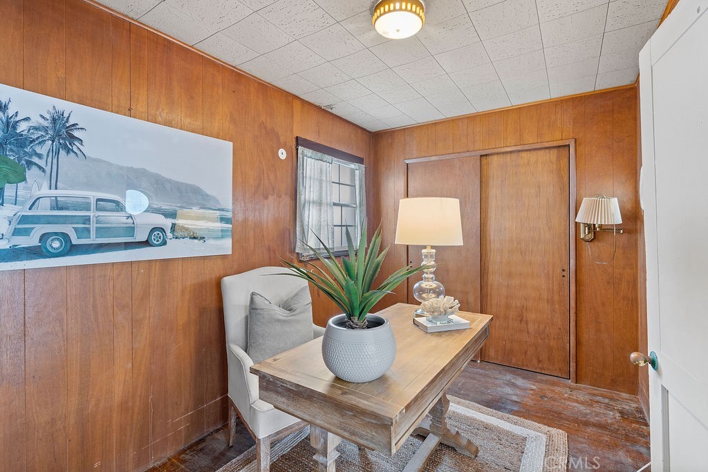 94 A Surfside Seal Beach, CA 90740 - Photo 14 of 33 a dining room with furniture and wooden floor