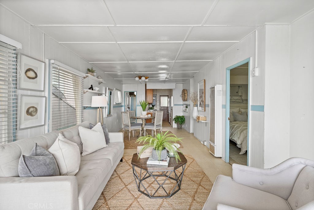94 A Surfside Seal Beach, CA 90740 - Photo 15 of 33 a living room with furniture and a chandelier