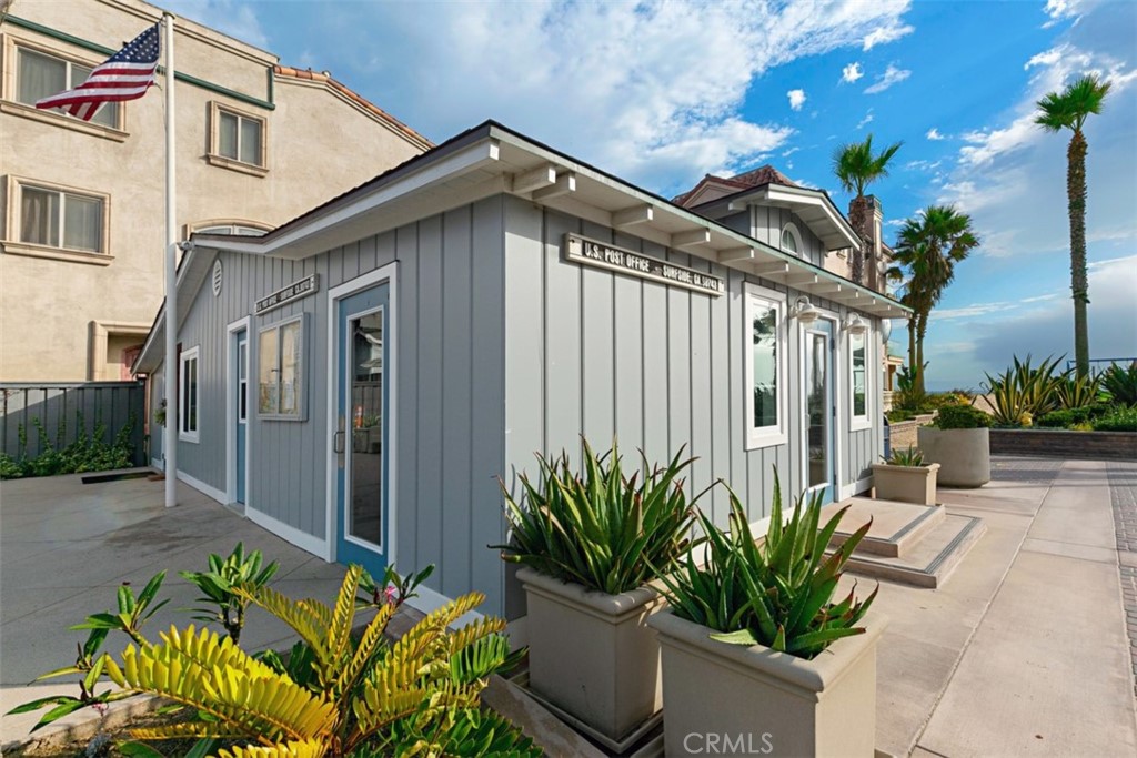 94 A Surfside Seal Beach, CA 90740 - Photo 25 of 33 a front view of a house with a yard