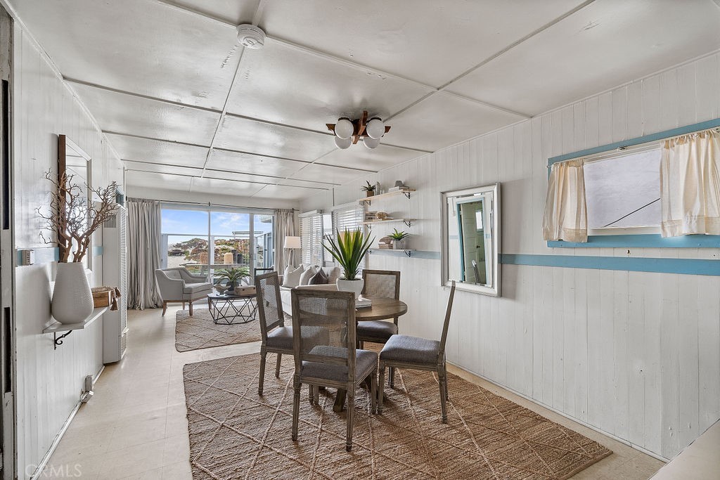 94 A Surfside Seal Beach, CA 90740 - Photo 4 of 33 a view of a dining room with furniture