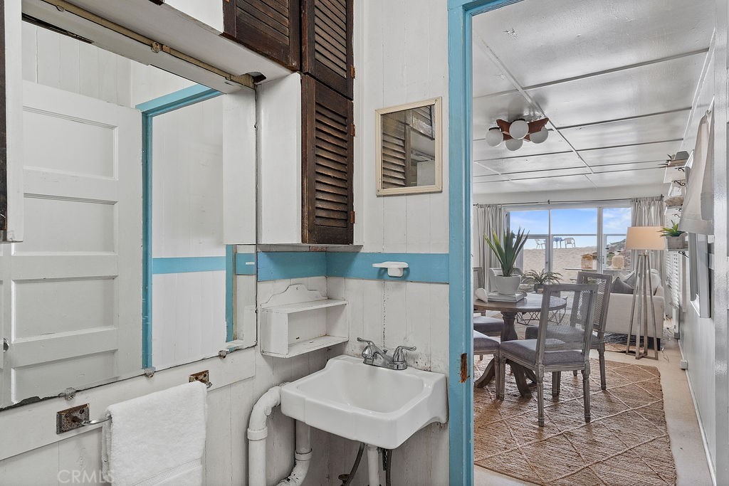 94 A Surfside Seal Beach, CA 90740 - Photo 7 of 33 a bathroom with a sink and a mirror