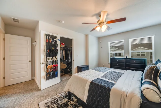 a bedroom with a bed and a closet