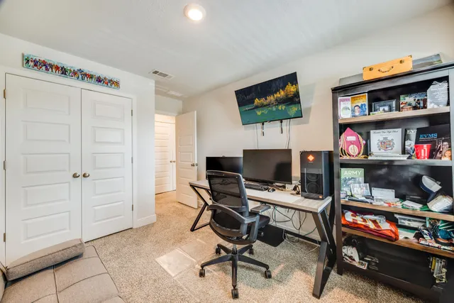 a view of a workspace with furniture