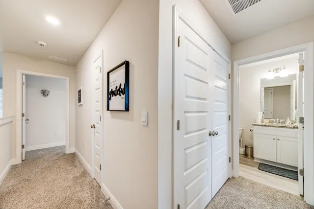 wooden floor with white cabinets