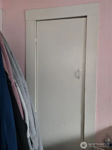 a storage room with furniture and a window